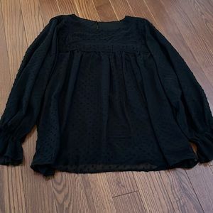 Great black blouse with eyelet detail.  Size M but runs large